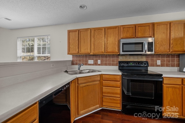 11929 Kings Castle Ct, Charlotte, NC 28277 - kitchen with light countertops, a sink, tasteful backsplash, and black appliances