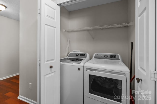 11929 Kings Castle Ct, Charlotte, NC 28277 - laundry area with a textured ceiling, baseboards, wood finished floors, laundry area, and washer and dryer