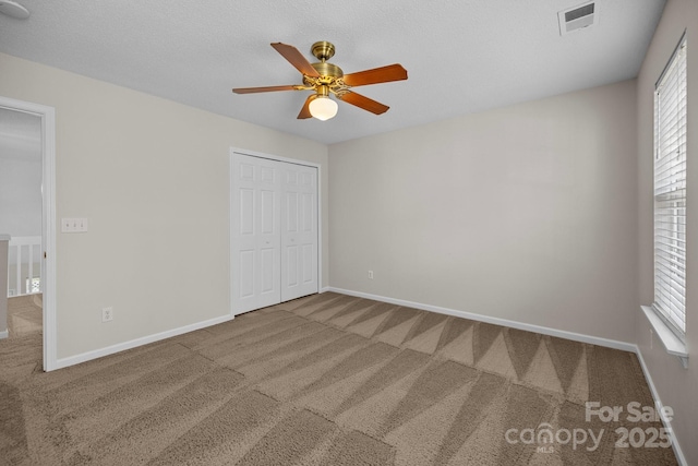11929 Kings Castle Ct, Charlotte, NC 28277 - unfurnished bedroom featuring baseboards, visible vents, a closet, and carpet