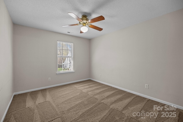 11929 Kings Castle Ct, Charlotte, NC 28277 - carpeted spare room with baseboards, visible vents, ceiling fan, and a textured ceiling