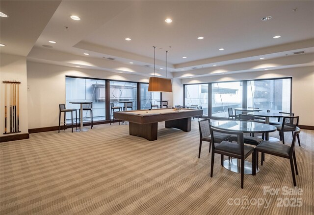 230 S Tryon St Unit 610, Charlotte, NC 28202 - rec room with light carpet, baseboards, a tray ceiling, and recessed lighting