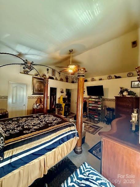 bedroom with lofted ceiling and carpet