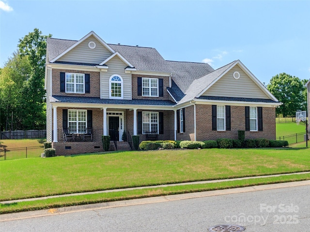 706 Springwood Dr Unit 14, Waxhaw, NC 28173 - traditional home featuring brick siding, a front lawn, fence, and crawl space