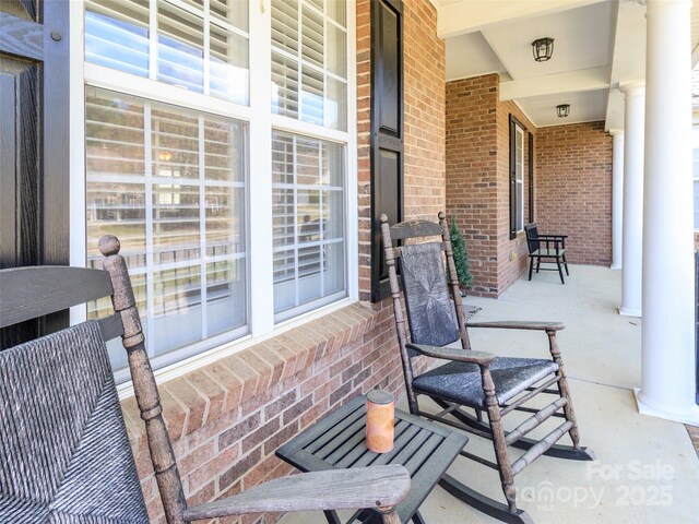 706 Springwood Dr Unit 14, Waxhaw, NC 28173 - view of patio / terrace featuring covered porch