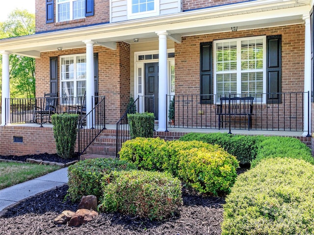 706 Springwood Dr Unit 14, Waxhaw, NC 28173 - property entrance with brick siding and covered porch
