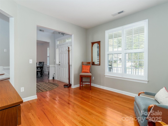 706 Springwood Dr Unit 14, Waxhaw, NC 28173 - living area featuring light wood-style floors, baseboards, and visible vents