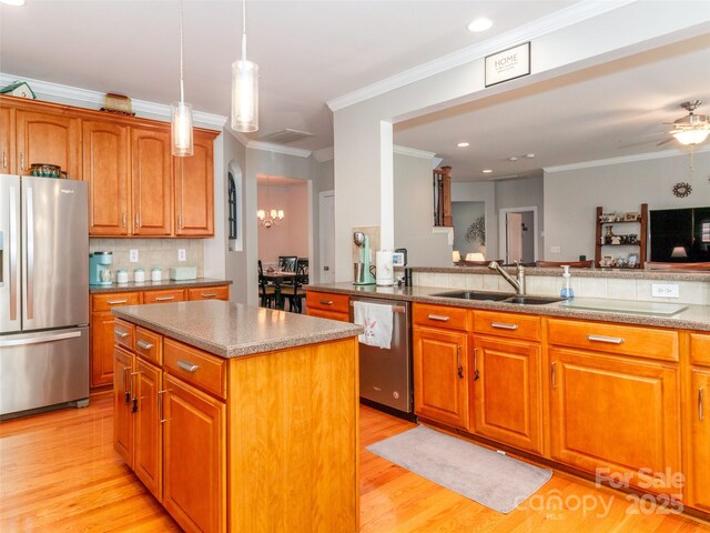 706 Springwood Dr Unit 14, Waxhaw, NC 28173 - kitchen with a sink, brown cabinets, decorative backsplash, and stainless steel appliances