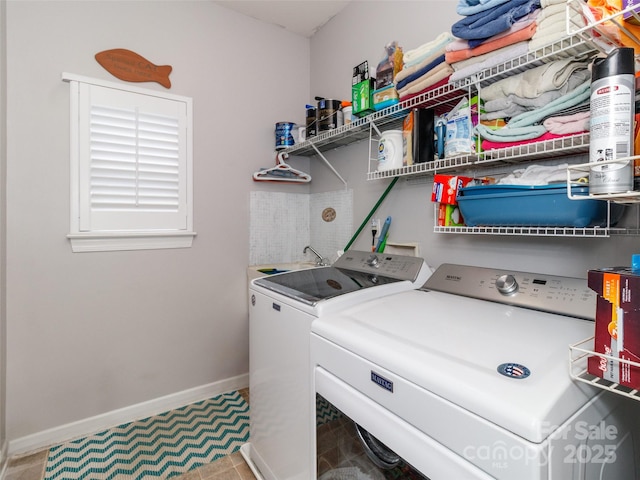 706 Springwood Dr Unit 14, Waxhaw, NC 28173 - washroom with baseboards, washing machine and dryer, and laundry area