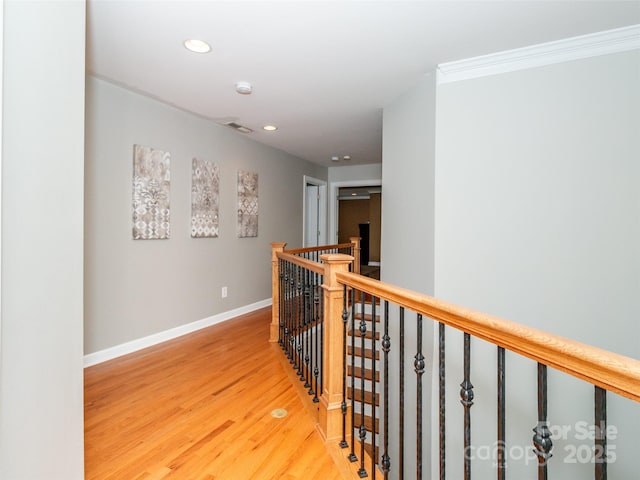 706 Springwood Dr Unit 14, Waxhaw, NC 28173 - corridor featuring ornamental molding, recessed lighting, wood finished floors, an upstairs landing, and baseboards