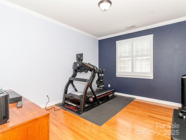 706 Springwood Dr Unit 14, Waxhaw, NC 28173 - workout room with wood finished floors, baseboards, ornamental molding, and visible vents