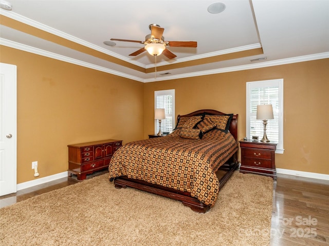 706 Springwood Dr Unit 14, Waxhaw, NC 28173 - bedroom with wood finished floors, baseboards, multiple windows, and visible vents