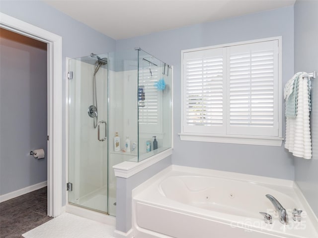 706 Springwood Dr Unit 14, Waxhaw, NC 28173 - bathroom with a bath, a stall shower, baseboards, and tile patterned flooring