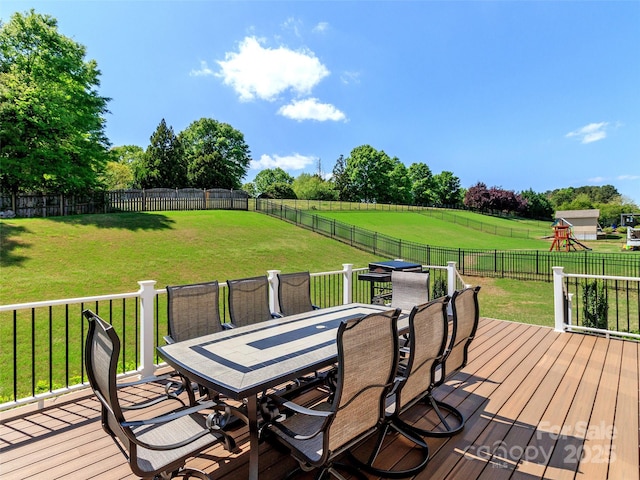706 Springwood Dr Unit 14, Waxhaw, NC 28173 - wooden deck featuring a fenced backyard, outdoor dining area, and a lawn