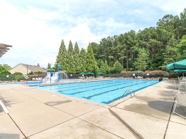 706 Springwood Dr Unit 14, Waxhaw, NC 28173 - community pool featuring fence, a patio, a water play area, and a water slide
