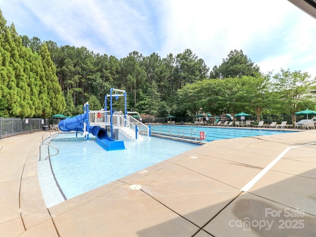 706 Springwood Dr Unit 14, Waxhaw, NC 28173 - pool with a patio area, a water slide, fence, playground community, and a water play area