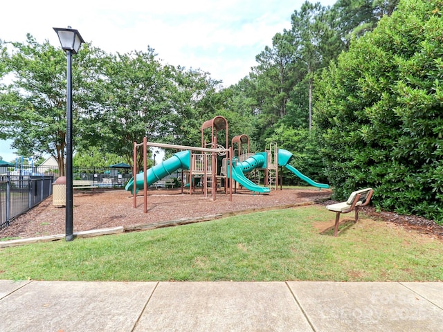 706 Springwood Dr Unit 14, Waxhaw, NC 28173 - community jungle gym with a yard and fence