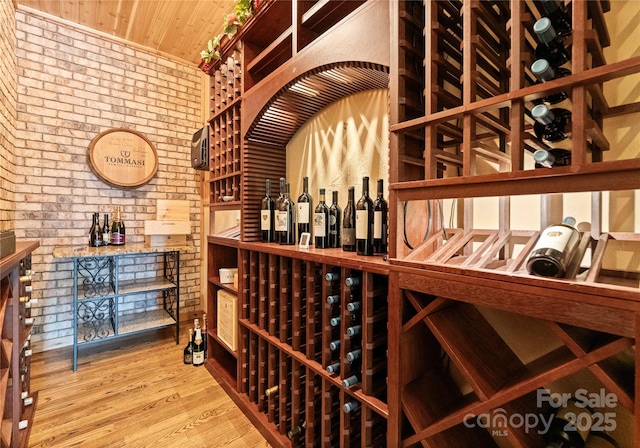 18420 Rosapenny Rd, Charlotte, NC 28278 - wine cellar featuring brick wall, wood ceiling, and wood finished floors