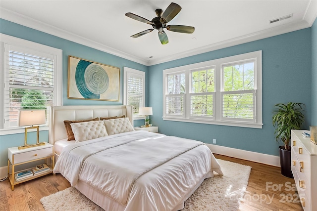 18420 Rosapenny Rd, Charlotte, NC 28278 - bedroom featuring ornamental molding, baseboards, wood finished floors, and a ceiling fan