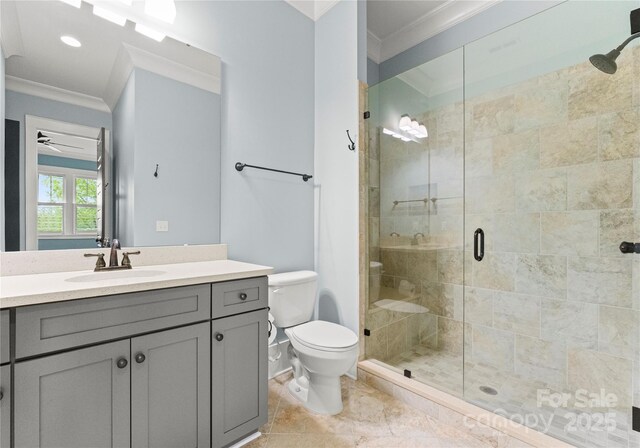 18420 Rosapenny Rd, Charlotte, NC 28278 - bathroom with crown molding, a shower stall, toilet, vanity, and a ceiling fan