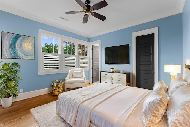 18420 Rosapenny Rd, Charlotte, NC 28278 - bedroom featuring baseboards, wood finished floors, a ceiling fan, and crown molding