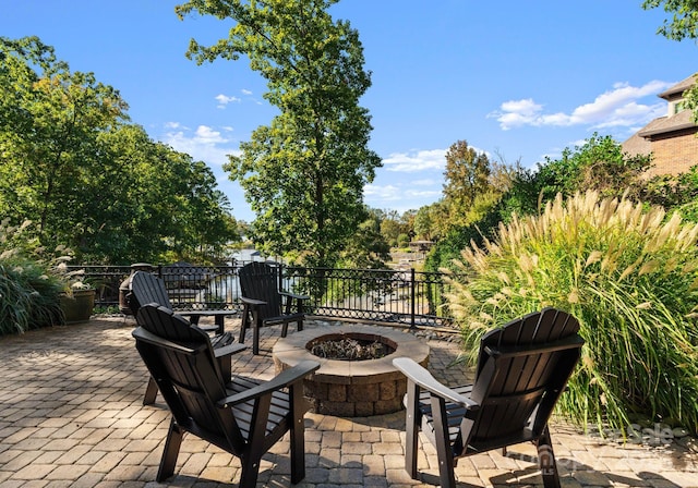 18420 Rosapenny Rd, Charlotte, NC 28278 - view of patio featuring an outdoor fire pit
