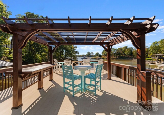 18420 Rosapenny Rd, Charlotte, NC 28278 - view of patio with a pergola, outdoor dining space, and a deck with water view