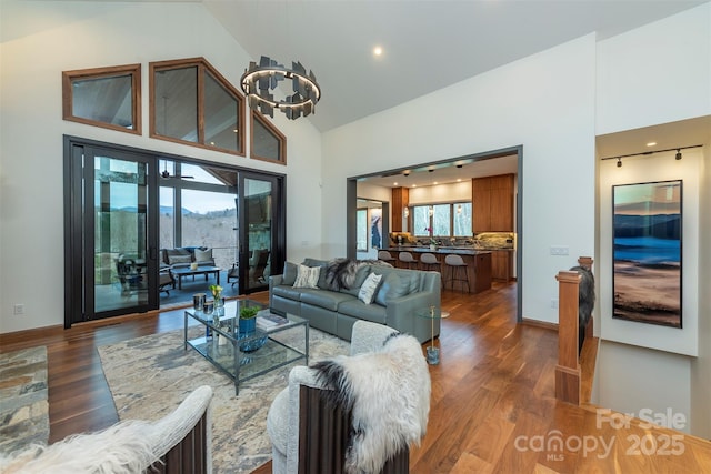 158 Riverbend Forest Dr Unit 15, Asheville, NC 28805 - living area with high vaulted ceiling, dark wood-style floors, and baseboards