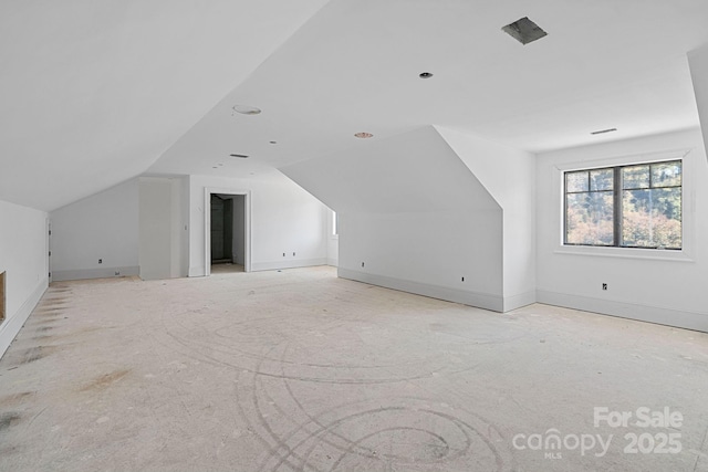 5039 Eliza Long Wilkie Dr, Huntersville, NC 28078 - bonus room with baseboards and lofted ceiling