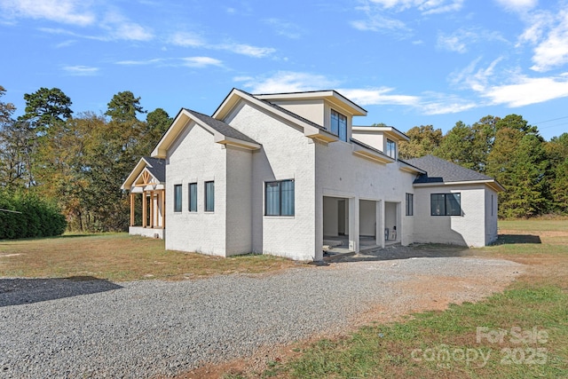 5039 Eliza Long Wilkie Dr, Huntersville, NC 28078 - exterior space with a front yard, gravel driveway, and brick siding