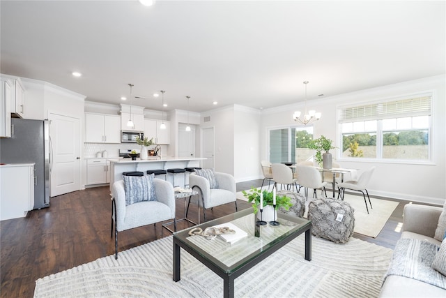 living room with baseboards, a chandelier, recessed lighting, crown molding, and dark wood finished floors