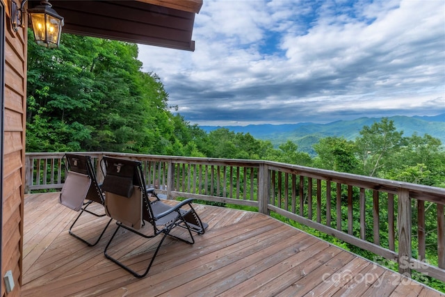 wooden deck with a mountain view