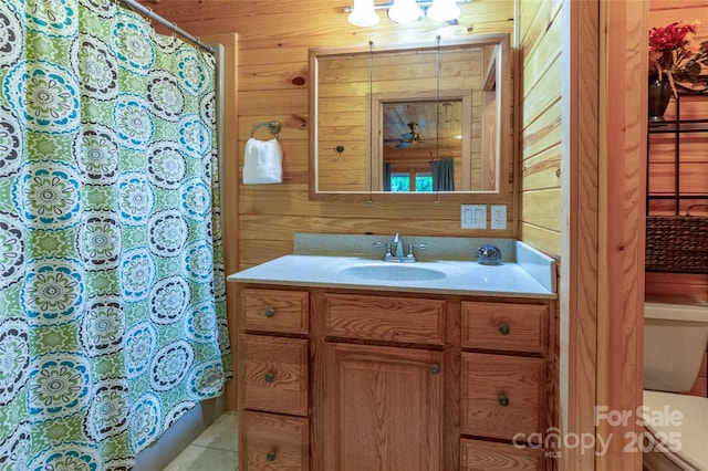 bathroom with wood walls and curtained shower