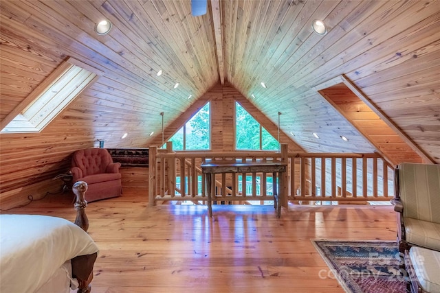 bedroom with vaulted ceiling with skylight, wooden ceiling, recessed lighting, and hardwood / wood-style flooring