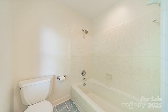 5232 Silchester Ln, Charlotte, NC 28215 - bathroom with tile patterned flooring, toilet, baseboards, and shower / bath combination