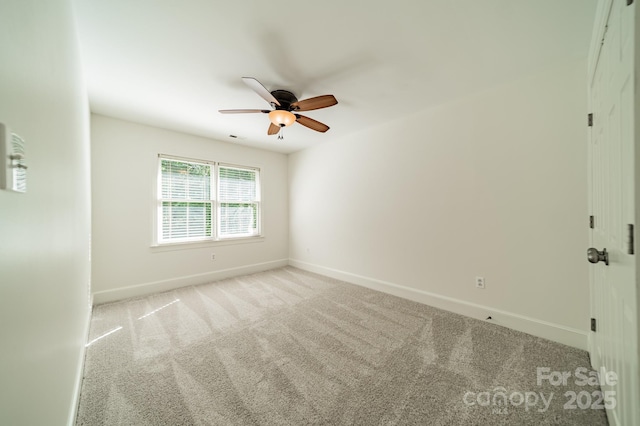 5232 Silchester Ln, Charlotte, NC 28215 - spare room featuring carpet flooring, baseboards, and ceiling fan