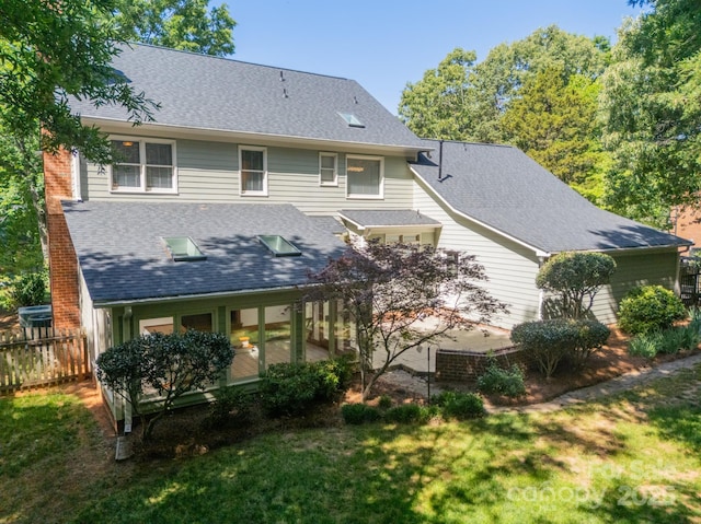 5232 Silchester Ln, Charlotte, NC 28215 - back of property with a shingled roof and a sunroom