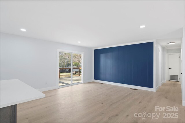 1315 Vickie Ln, Matthews, NC 28104 - spare room featuring light wood-style flooring, recessed lighting, and attic access