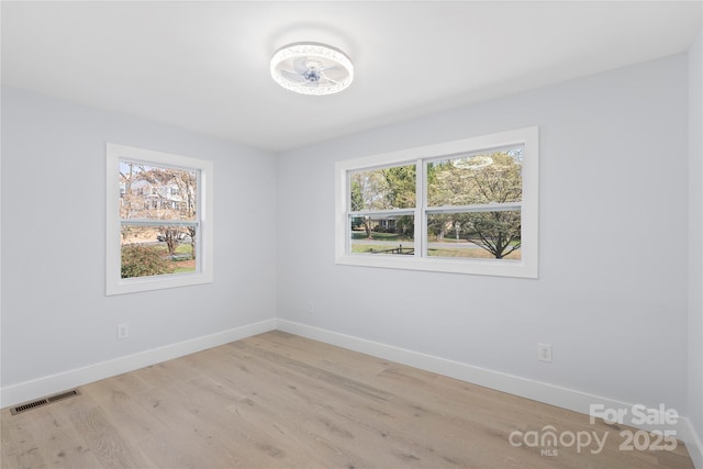 1315 Vickie Ln, Matthews, NC 28104 - spare room featuring baseboards and light wood finished floors
