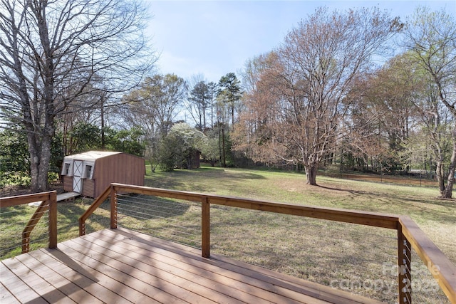 1315 Vickie Ln, Matthews, NC 28104 - wooden deck featuring a shed, a lawn, and view of wooded area