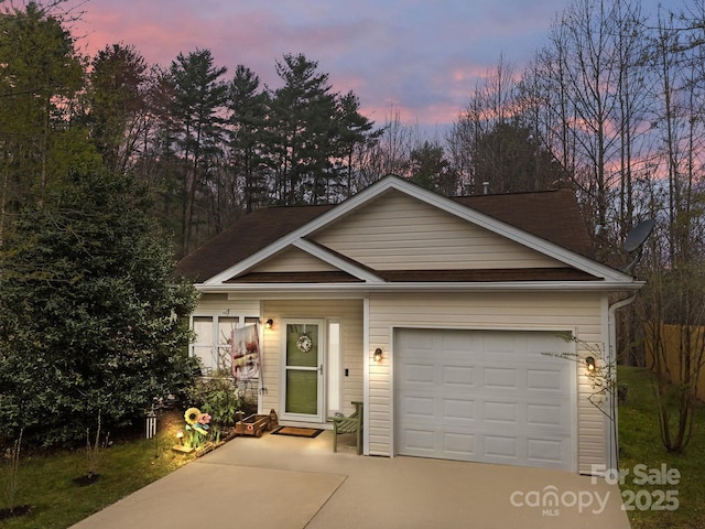 view of front of home featuring driveway and an attached garage