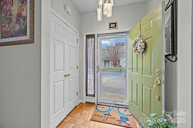 foyer entrance with a chandelier