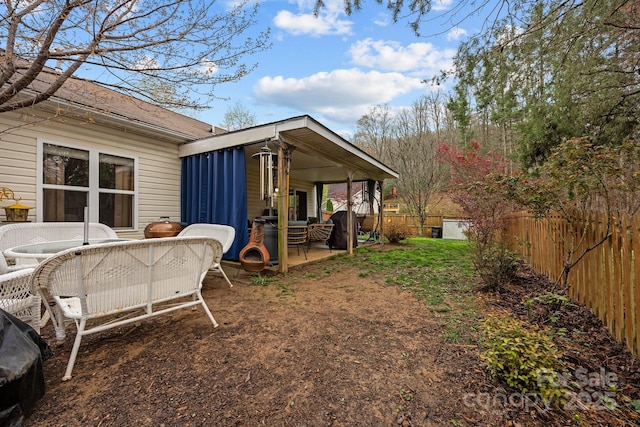 view of yard with a fenced backyard and a patio
