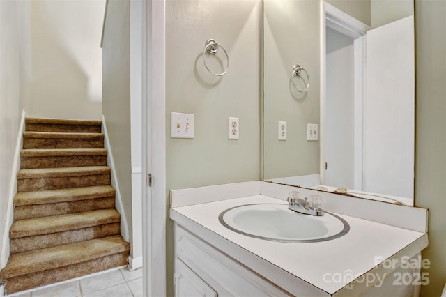 bathroom with tile patterned flooring and vanity