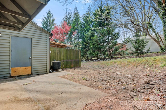 exterior space featuring fence, a patio, and cooling unit