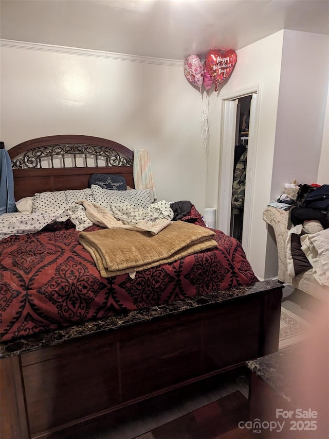 bedroom featuring ornamental molding