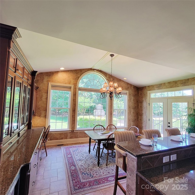 708 Ridgelake Dr, Weddington, NC 28104 - dining room with vaulted ceiling, plenty of natural light, a chandelier, and french doors
