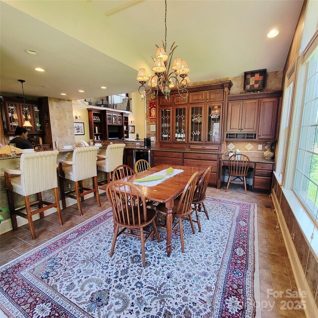 708 Ridgelake Dr, Weddington, NC 28104 - dining area featuring a chandelier, recessed lighting, and lofted ceiling