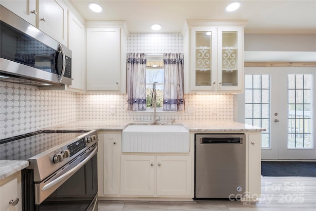 4487 Catawba Burris Rd, Denver, NC 28037 - kitchen with a sink, stainless steel appliances, light stone countertops, and a wealth of natural light