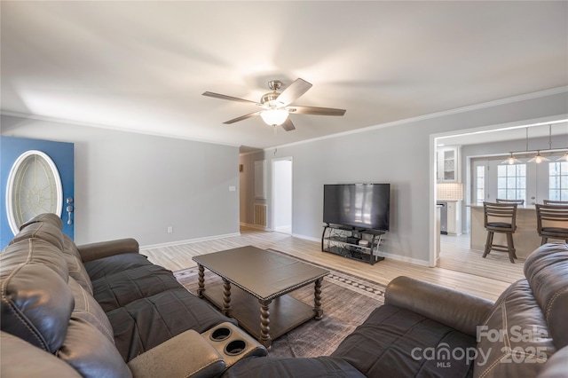 4487 Catawba Burris Rd, Denver, NC 28037 - living room featuring a ceiling fan, light wood-style flooring, crown molding, and baseboards