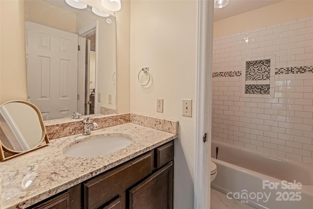 full bathroom featuring toilet, shower / bathtub combination, and vanity